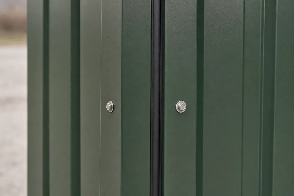 Close-up of hunter green TEMLOC 18-gauge steel wall panels with bolted vertical joint